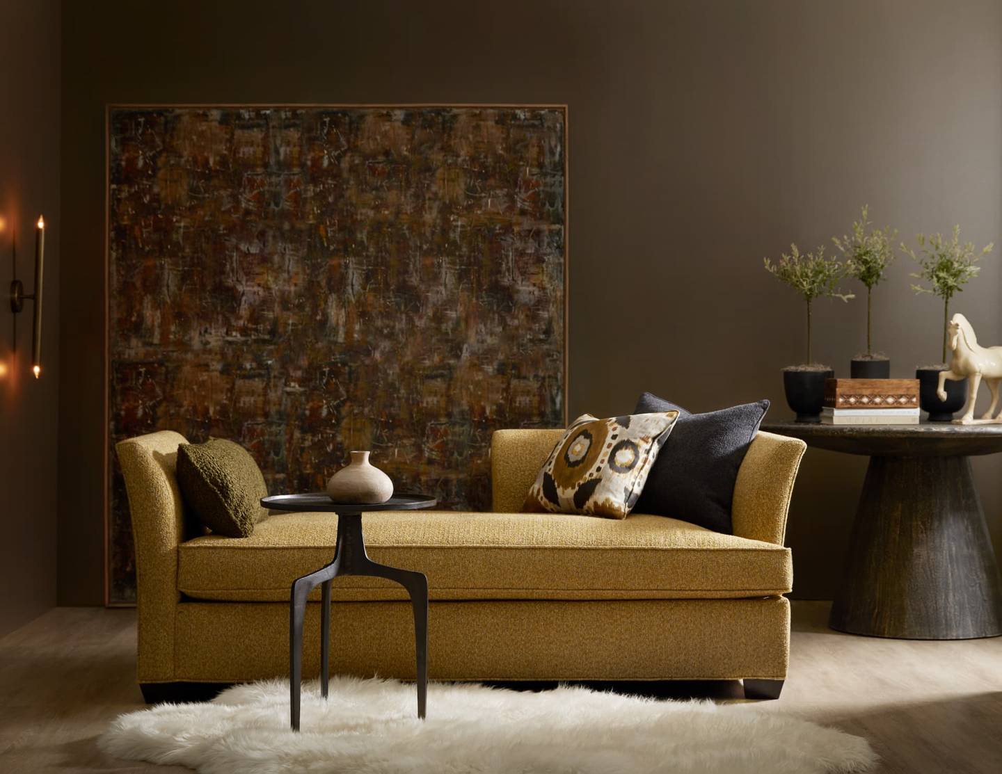 Settee in golden mustard fabric shown as a showroom display piece