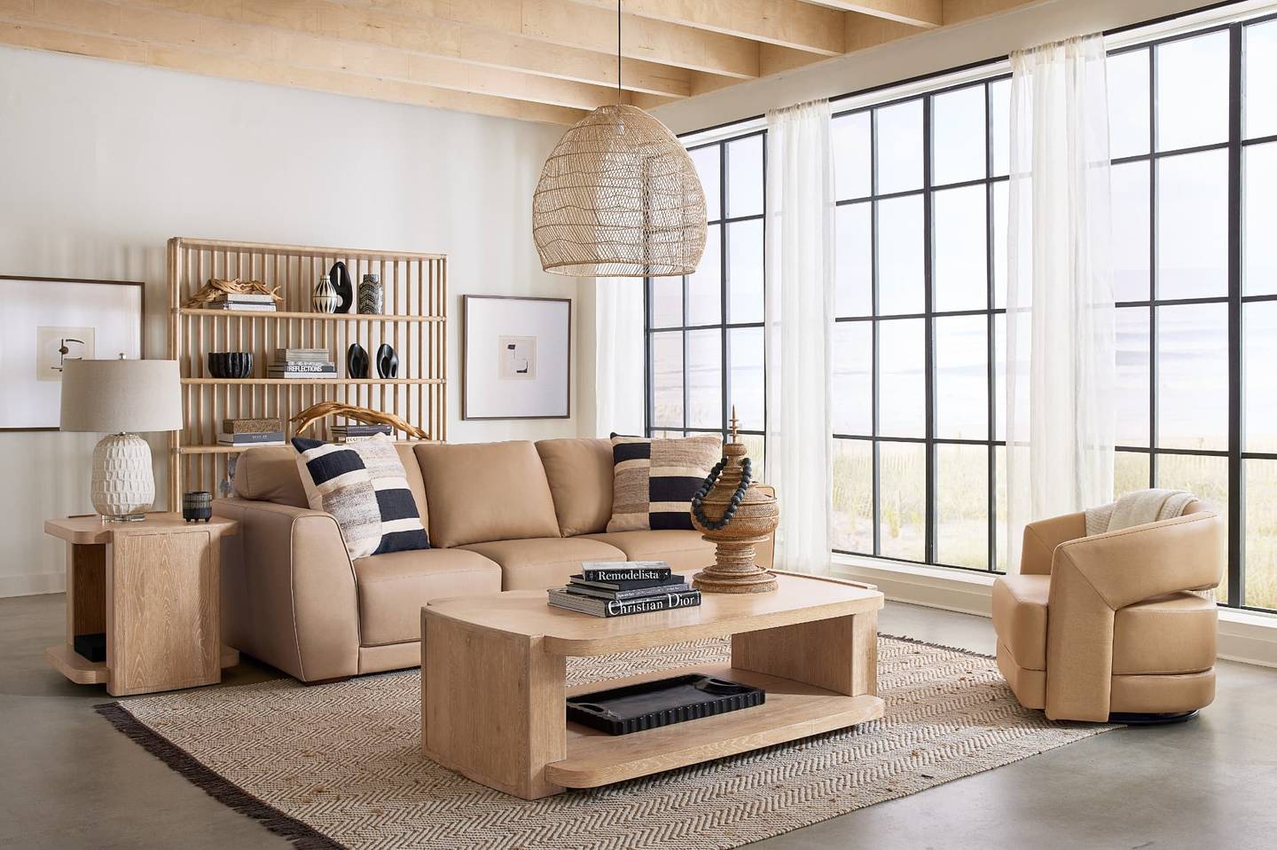 Modern Maryland living room furnished with a tan leather reclining sectional from Gavigan's