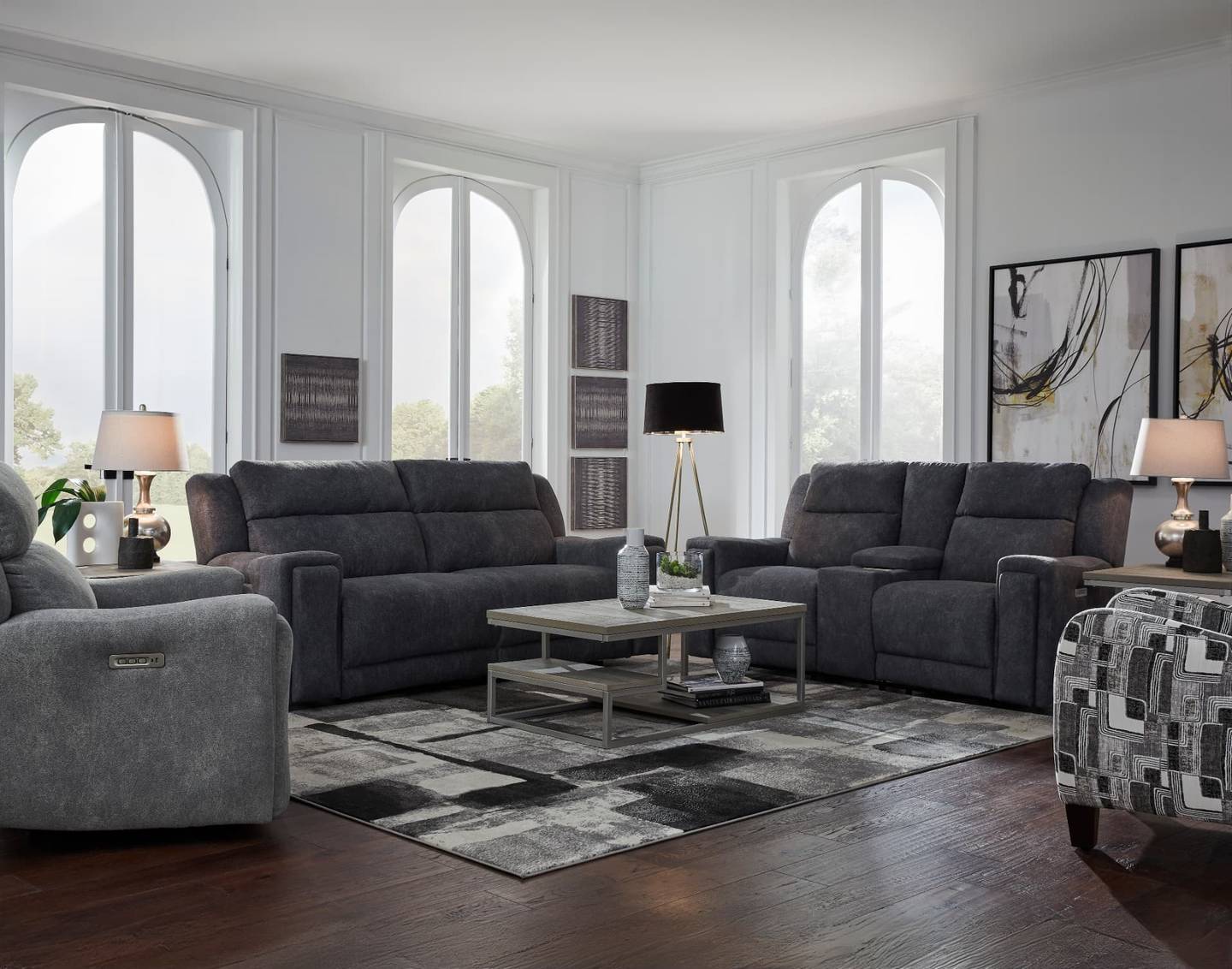 Charcoal reclining sofa, loveseat, and recliner group in a granite-toned fabric