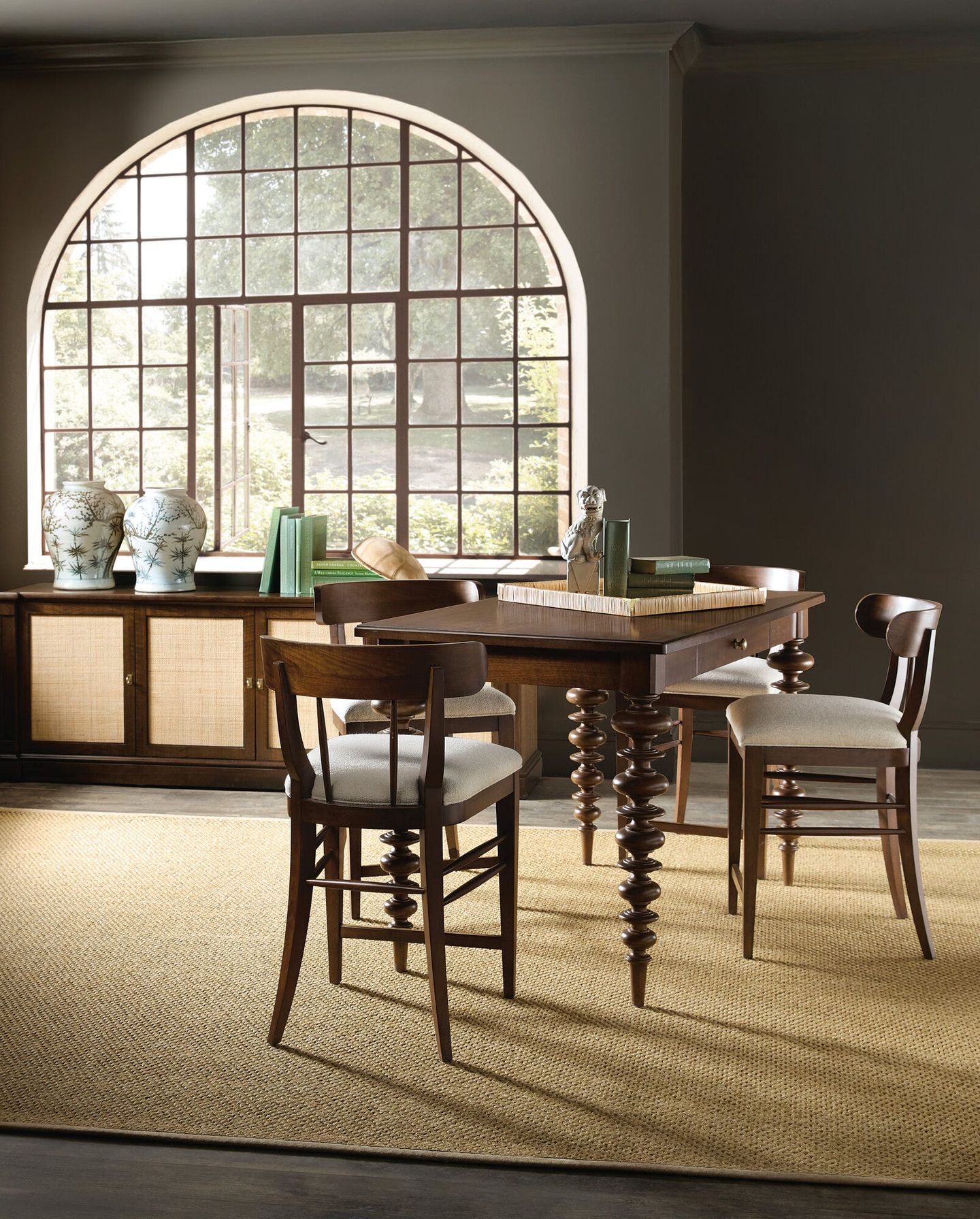 Hooker Furniture Archives collection dining table, chairs, and cane-front credenza styled in a sunlit room